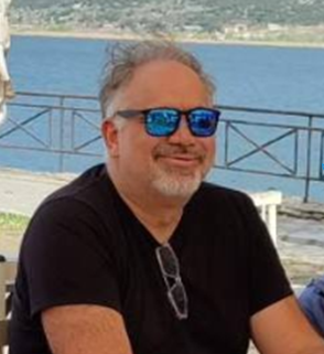 George Monemvasitis by the water in Greece